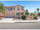 Charming two-story home with a two-car garage, desert landscaping, and a red tile roof at 3194 Lapis Beach Dr, Las Vegas, NV 89117
