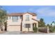 Charming two-story home featuring a two-car garage, neutral stucco, and stylish architectural details at 3194 Lapis Beach Dr, Las Vegas, NV 89117