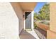 Inviting front entrance with a decorative security door, textured walls, and a desert landscape at 3194 Lapis Beach Dr, Las Vegas, NV 89117