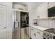 Spacious kitchen with stainless steel refrigerator and tiled backsplash at 3194 Lapis Beach Dr, Las Vegas, NV 89117