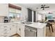 Open kitchen boasts quartz countertops, stainless steel appliances, and a modern faucet at 3194 Lapis Beach Dr, Las Vegas, NV 89117