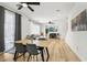 Bright living room features wood floors, open concept layout and modern furnishings at 3194 Lapis Beach Dr, Las Vegas, NV 89117