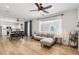Spacious living room with hardwood floors, a dining area, and a comfortable gray sofa set at 3194 Lapis Beach Dr, Las Vegas, NV 89117