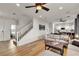 Bright living room with hardwood floors, a modern sofa, and stairs leading to the second floor at 3194 Lapis Beach Dr, Las Vegas, NV 89117