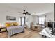 Spacious main bedroom with a queen bed, a daybed, and a modern work-space providing style and function at 3194 Lapis Beach Dr, Las Vegas, NV 89117