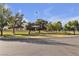Picturesque park with lush green lawns, mature trees, and a playground, offering a serene recreational space at 3194 Lapis Beach Dr, Las Vegas, NV 89117
