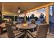 Inviting covered patio with a cozy fire pit and ample seating, perfect for outdoor relaxation and entertainment at 3194 Lapis Beach Dr, Las Vegas, NV 89117