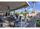 Covered patio features an outdoor ceiling fan and comfortable seating area at 3194 Lapis Beach Dr, Las Vegas, NV 89117