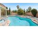 Stunning pool and spa offer the perfect outdoor relaxation space with lush landscaping at 3194 Lapis Beach Dr, Las Vegas, NV 89117