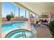 Inviting covered patio overlooks a sparkling pool, spa, and meticulously landscaped backyard at 3194 Lapis Beach Dr, Las Vegas, NV 89117
