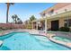 Inviting pool and spa with covered patio, perfect for outdoor entertaining and relaxation at 3194 Lapis Beach Dr, Las Vegas, NV 89117