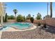 Serene backyard with a sparkling pool, mature landscaping, and inviting patio area for leisure at 3194 Lapis Beach Dr, Las Vegas, NV 89117