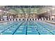 Indoor swimming pool with many lanes, blue and yellow lane markers, and bright, overhead lighting at 3194 Lapis Beach Dr, Las Vegas, NV 89117