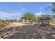 Beautiful walking trail surrounded by desert landscape and leading to neighborhood homes under a sunny sky at 3194 Lapis Beach Dr, Las Vegas, NV 89117