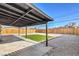 Backyard featuring a grass patch, white gravel, and covered patio at 333 Rossmoyne Ave, North Las Vegas, NV 89030