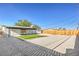 Backyard with grass patch, white gravel, and covered patio at 333 Rossmoyne Ave, North Las Vegas, NV 89030
