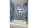 Refreshed bathroom showcasing new tile, a tub with shower, and a convenient niche at 333 Rossmoyne Ave, North Las Vegas, NV 89030