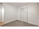 An empty bedroom, has new carpet, a large closet, and is lit by modern recessed lighting at 333 Rossmoyne Ave, North Las Vegas, NV 89030