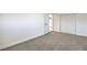 An airy bedroom features a sliding-door closet and neutral paint for a calming atmosphere at 333 Rossmoyne Ave, North Las Vegas, NV 89030