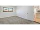 This bedroom offers plush carpet and a window view, freshly painted in a neutral color at 333 Rossmoyne Ave, North Las Vegas, NV 89030