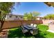 Cozy backyard featuring a well-maintained lawn and a patio with an outdoor table set at 3553 Terneza Ave, North Las Vegas, NV 89081
