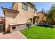 This backyard features an outdoor kitchen area and a dining table for relaxing and entertaining at 3553 Terneza Ave, North Las Vegas, NV 89081