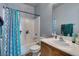 Bathroom featuring a shower-tub combo, and a sink with vanity and modern fixtures at 3553 Terneza Ave, North Las Vegas, NV 89081
