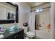 Bathroom with sink, toilet, mirror, and shower/tub at 3553 Terneza Ave, North Las Vegas, NV 89081