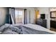 Cozy bedroom with carpeted floors, a modern color scheme, and balcony access at 3553 Terneza Ave, North Las Vegas, NV 89081