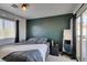 Cozy bedroom with carpeted floors, a modern color scheme, and balcony access at 3553 Terneza Ave, North Las Vegas, NV 89081