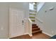 Inviting foyer with hardwood floors, staircase, and natural light streaming in from the overhead window at 3553 Terneza Ave, North Las Vegas, NV 89081