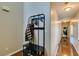 Hallway with hardwood floors and a coat rack with a bench and shoe storage at 3553 Terneza Ave, North Las Vegas, NV 89081