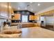 Well-equipped kitchen featuring wooden cabinets, stainless steel appliances, and ample countertop space at 3553 Terneza Ave, North Las Vegas, NV 89081