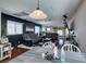 Spacious living room with hardwood floors, modern furniture, and updated lighting fixtures at 3553 Terneza Ave, North Las Vegas, NV 89081