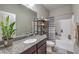 Bathroom featuring a vanity with granite countertops, a toilet, and a shower with a striped curtain at 406 Gracious Way, Henderson, NV 89011