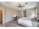 Bedroom features a ceiling fan, a bed, desk and chair, and great natural light at 406 Gracious Way, Henderson, NV 89011