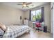 Bedroom with a bed, desk and chair, and a window providing natural light at 406 Gracious Way, Henderson, NV 89011