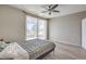 Bedroom with wood-look floors, ceiling fan, and large glass doors to the outside at 406 Gracious Way, Henderson, NV 89011