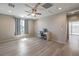 Open bedroom with a ceiling fan, desk and chair, and sliding doors for outdoor access at 406 Gracious Way, Henderson, NV 89011