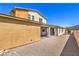 The backyard reveals the home's architectural lines, covered patio, and low-maintenance landscaping at 406 Gracious Way, Henderson, NV 89011