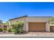 Detached two-car garage featuring desert landscaping and a brick-lined driveway at 406 Gracious Way, Henderson, NV 89011