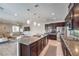 Well-lit kitchen with stainless appliances, large island and breakfast bar, and sleek cabinetry at 406 Gracious Way, Henderson, NV 89011