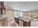 Open kitchen featuring stainless steel appliances, granite countertops, and breakfast bar at 406 Gracious Way, Henderson, NV 89011