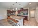 Contemporary kitchen with spacious island, counter seating, and ample cabinet storage at 406 Gracious Way, Henderson, NV 89011