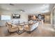 Spacious living room boasts hardwood floors, modern ceiling fan, and access to the kitchen at 406 Gracious Way, Henderson, NV 89011