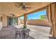 Covered patio with ceiling fans and drapes at 406 Gracious Way, Henderson, NV 89011