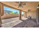 Enjoy this covered patio, featuring brick floors and dual ceiling fans, perfect for outdoor living at 406 Gracious Way, Henderson, NV 89011