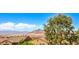 Neighborhood rooftops with view of mountains in distance at 406 Gracious Way, Henderson, NV 89011
