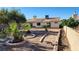 Backyard featuring desert landscaping with palm trees and patio at 4285 El Como Way, Las Vegas, NV 89121
