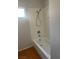 Bathroom with a shower/tub combo with white tile at 4285 El Como Way, Las Vegas, NV 89121